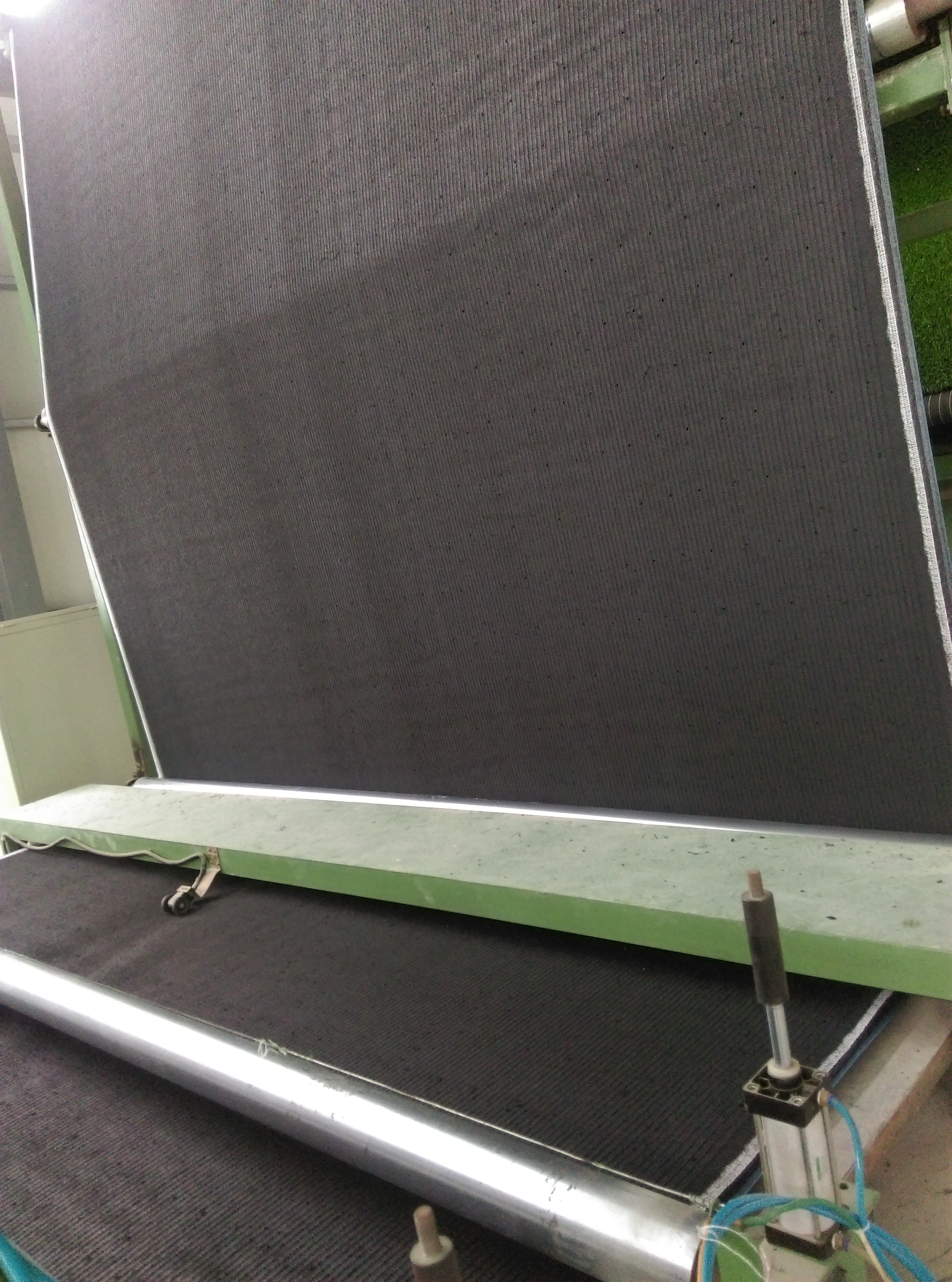 What Keeps Artificial Grass Tufts in Place?