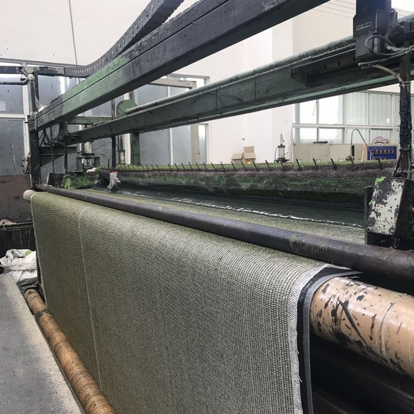 What Keeps Artificial Grass Tufts in Place?